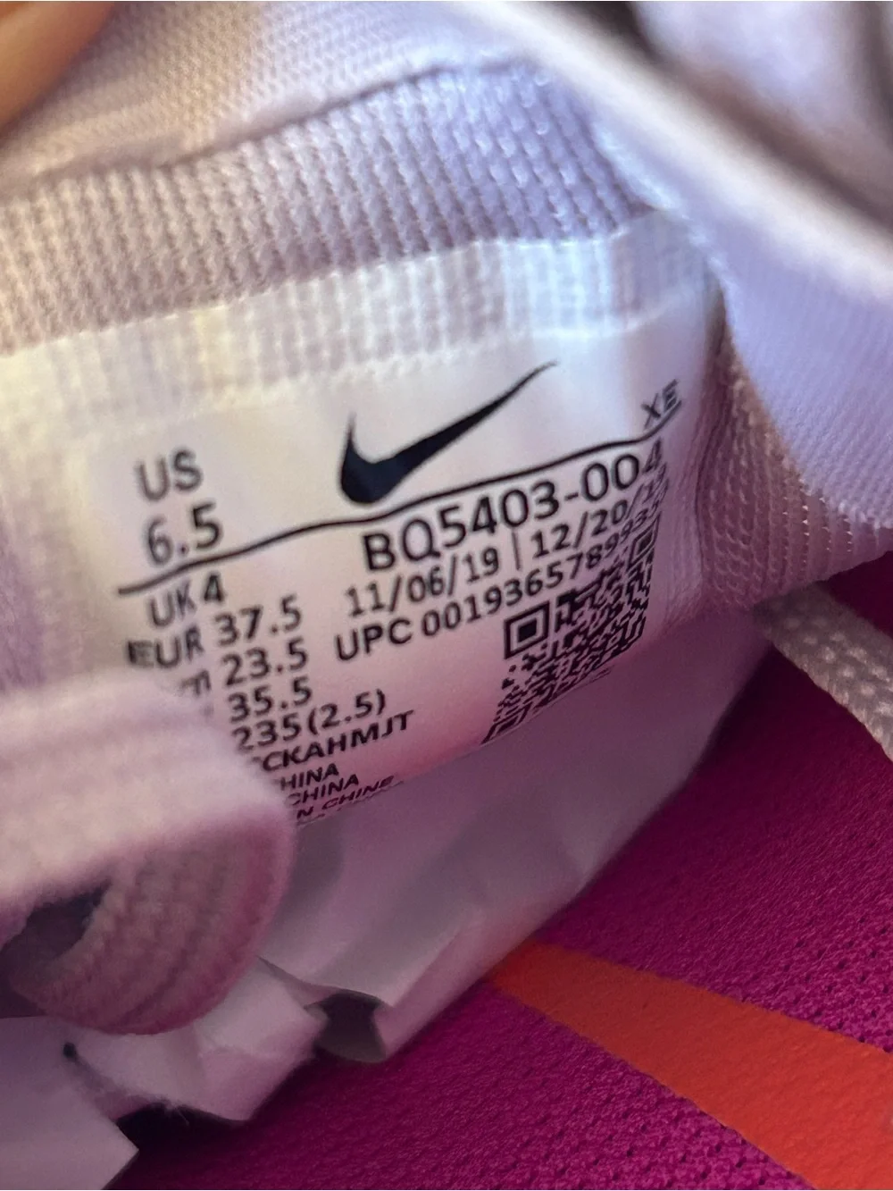 Nike Women's Light Beige Athletic Sneakers with Pink Accents